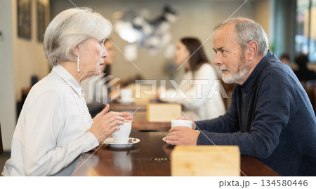 Elderly couple on a date in a cafe Elderly couple on a date in a cafe 134580446