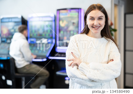 Girl administrator of slot machine room 134580490