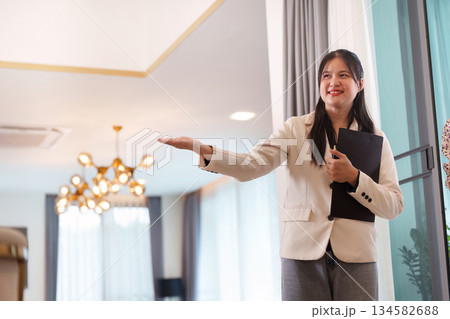 Real Estate Agent Presenting Property Features to Potential Buyers 134582688