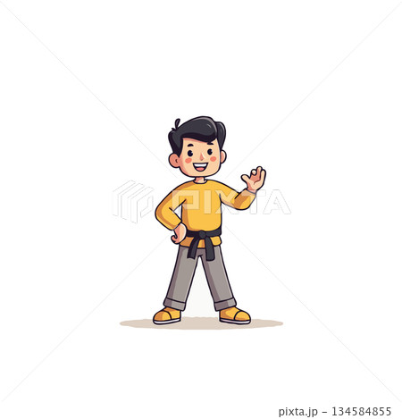Enthusiastic karate kid demonstrating confidence and sporting a proud black belt in his martial 134584855