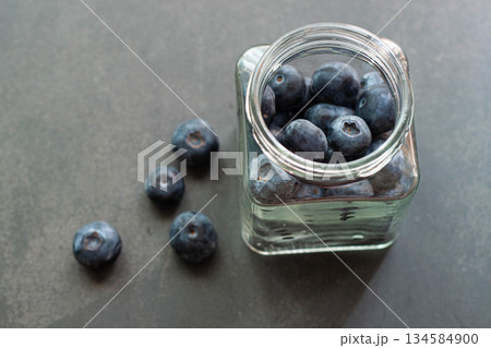 Fresh blueberries in a glass jar healthy fruit and antioxidants Fresh blueberries in a glass jar healthy fruit and antioxidants 134584900