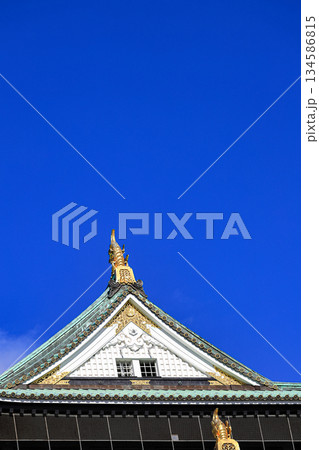 Close up detail of Osaka castle with autumn blue sky white cloud, frame one of japan's best destination for travel, Osaka Japan. 134586815