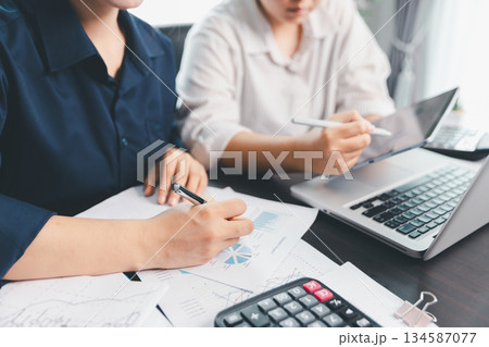Business meeting, data analytics or women with graph presentation in office. Chart, analysis accounting team brainstorming economy, inflation or solution. business project finance investment concept. 134587077