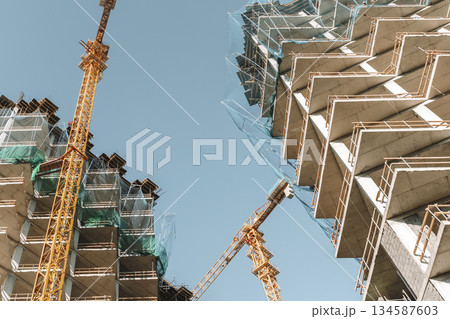 Construction of a building. Construction site with crane. Business, development, industry. Construction of a building. Construction site with crane. Business, development, industry. 134587603