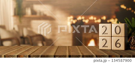 2026 new year wooden blocks calendar on table across fireplace and bricks wall with Christmas tree. 2026 new year wooden blocks calendar on table across fireplace and bricks wall with Christmas tree. 134587900