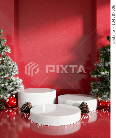 Empty white round marble display platforms with Christmas tree pinecone ornaments in red background. Empty white round marble display platforms with Christmas tree pinecone ornaments in red background. 134587906