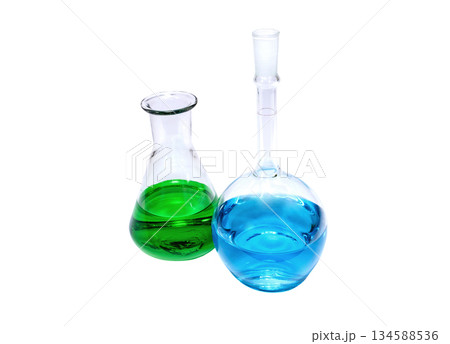 Chemical flasks with green and blue liquid on a white background Chemical flasks with green and blue liquid on a white background 134588536