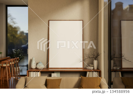 Large blank drawing or photo frame on wooden bookshelf in front of a wall in cosy stye living room. Large blank drawing or photo frame on wooden bookshelf in front of a wall in cosy stye living room. 134588956