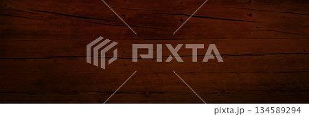 Dark brown wooden texture with grain pattern Dark brown wooden texture with grain pattern 134589294