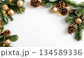 Festive Christmas background with pine branches, golden ornaments, and pine cones for holiday decor 134589336