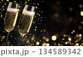 Sparkling champagne flutes with festive bokeh background for holiday celebration concept 134589342