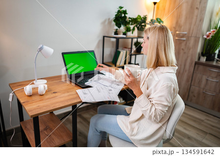Engaging in creative work at a cozy home office during daylight hours Engaging in creative work at a cozy home office during daylight hours 134591642
