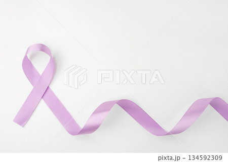 Lilac ribbon on white background. World Cancer Day on February 4. 134592309