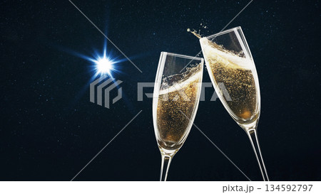 Two champagne glasses clinking in a festive toast against a dark starry night sky with a bright first star Christmas. Elegant celebration of New Year's Eve, luxury events, or a romantic anniversary 134592797