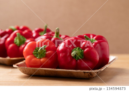 Red bell pepper or sweet pepper on wooden background Red bell pepper or sweet pepper on wooden background 134594873