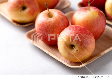 Red apple fruit (Gala apple) in natural plate on white background Red apple fruit (Gala apple) in natural plate on white background 134594902