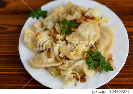 Traditional comfort food dumplings with savory onion and parsley 134595275