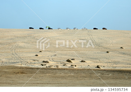Luxury jeep safari in the Qatari desert. Luxury jeep safari in the Qatari desert. 134595734