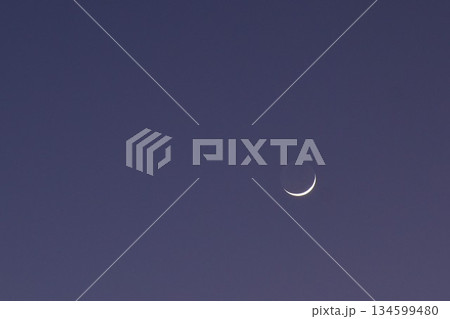 half moon floating on blue sky in twilight background half moon floating on blue sky in twilight background 134599480