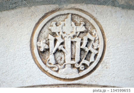 IHS sign on church facade in Korcula, Croatia IHS sign on church facade in Korcula, Croatia 134599655