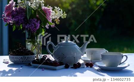 tea pot and flower on the window 134602735