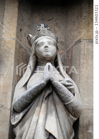 Saint Radegund statue on the portal of the Saint Germain l'Auxerrois church in Paris, France 134603321