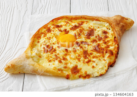 Adjarian Khachapuri with egg yolk and cheese 134604163
