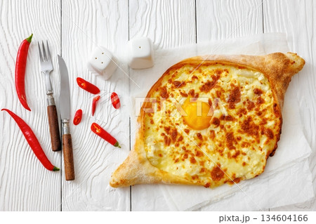 Adjarian Khachapuri with egg yolk and cheese Adjarian Khachapuri with egg yolk and cheese 134604166