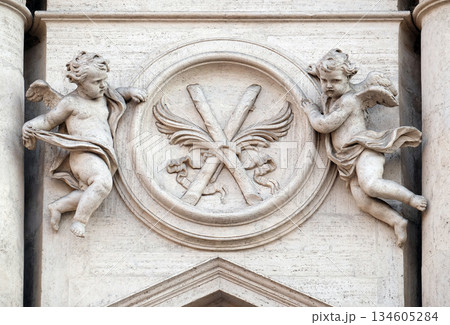 Angels with symbols of martyrdom on the portal of Sant Andrea della Valle Church in Rome, Italy Angels with symbols of martyrdom on the portal of Sant Andrea della Valle Church in Rome, Italy 134605284