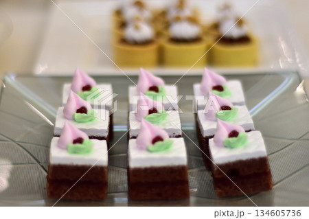 Decorative Dessert Squares on Glass Plate Decorative Dessert Squares on Glass Plate 134605736