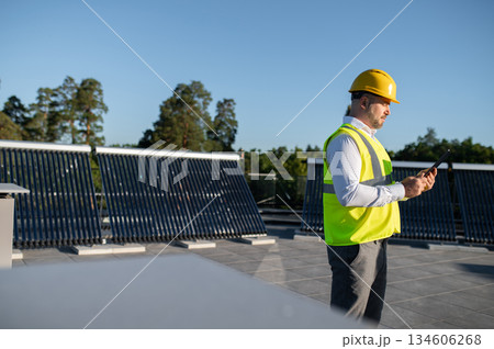 Professional man monitoring renewable energy system 134606268