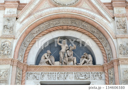 Lunette of the Resurrection, facade of San Petronio Basilica by Alfonso Lombardi in Bologna, Italy 134606380