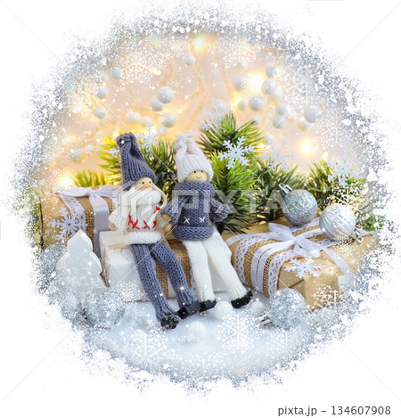Christmas or New Year greeting card. Christmas composition with toys dolls and spruce branches Christmas or New Year greeting card. Christmas composition with toys dolls and spruce branches 134607908