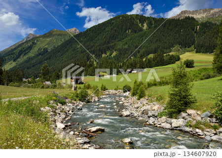 Summer mountain landscape and blue sky with clouds. Location place Alps, Europe. Summer mountain landscape and blue sky with clouds. Location place Alps, Europe. 134607920