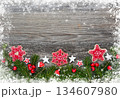 Christmas decorations and spruce branches on a wooden table. Festive background. Top view 134607980