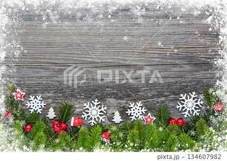 Christmas decorations and spruce branches on a wooden table. Festive  background. Top view 134607982