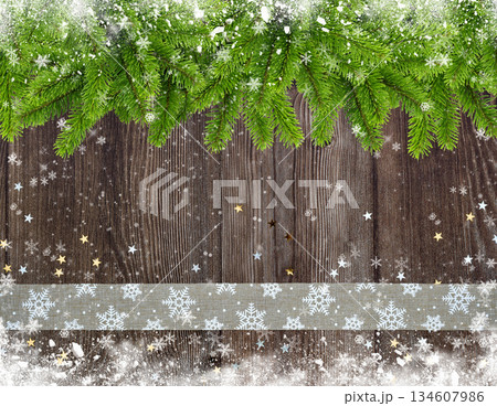 Christmas or New Year greeting card. Branches of spruce and ribbon with snowflakes and golden star Christmas or New Year greeting card. Branches of spruce and ribbon with snowflakes and golden star 134607986