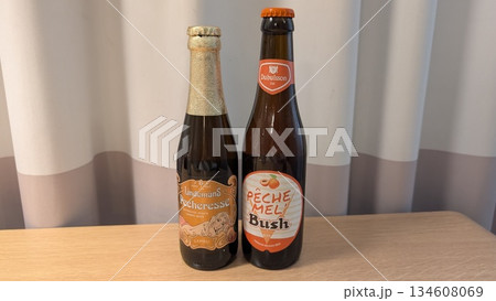 Peach beers in the bottle on the table 134608069