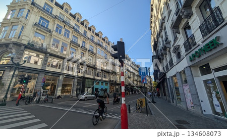 A narrow road with side walk and shops in the city A narrow road with side walk and shops in the city 134608073