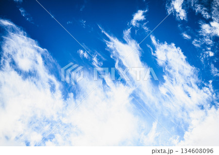 Blue sky with wispy white clouds background Blue sky with wispy white clouds background 134608096