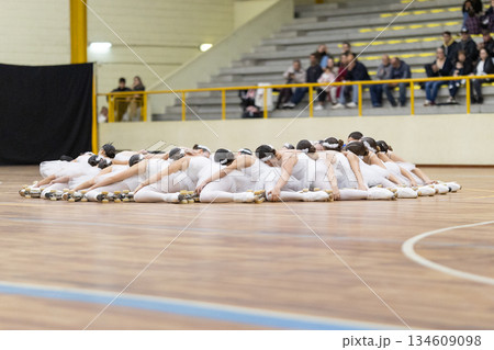 Group of roller skaters performing artistic choreography 134609098