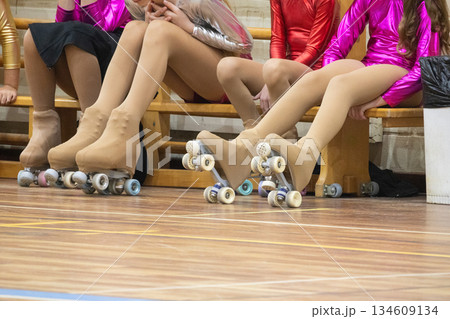 Artistic roller skaters sitting, resting during competition 134609134