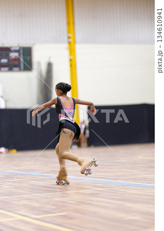 Young girl performing artistic roller skating routine Young girl performing artistic roller skating routine 134610941