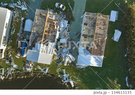View from abover of damaged mobile homes after hurricane Ian in Florida residential area. Consequences of natural disaster View from abover of damaged mobile homes after hurricane Ian in Florida residential area. Consequences of natural disaster 134613135