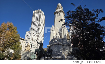 Magnificent architecture and statues at madrid plaza espana under clear blue sky. Madrid, Plaza Espana, Spain Square. Monument to Miguel de Cervantes Magnificent architecture and statues at madrid plaza espana under clear blue sky. Madrid, Plaza Espana, Spain Square. Monument to Miguel de Cervantes 134613205