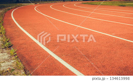 Red running track in stadium. Red running track in stadium. 134613998