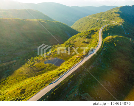 Road trough mountains Norway. Aerial view 134614076