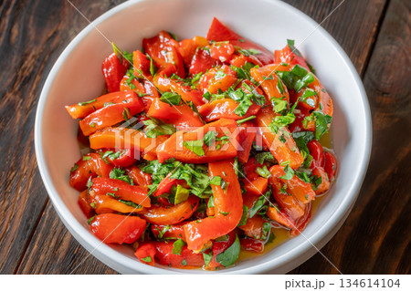 Mediterranean roasted red pepper medley with olive oil and fresh herbs 134614104