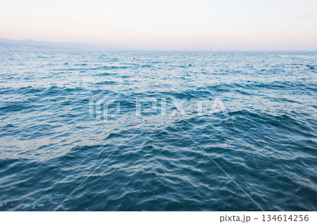 Ocean surface with rippling water patterns in natural light, peaceful seascape for backgrounds or nature themes 134614256