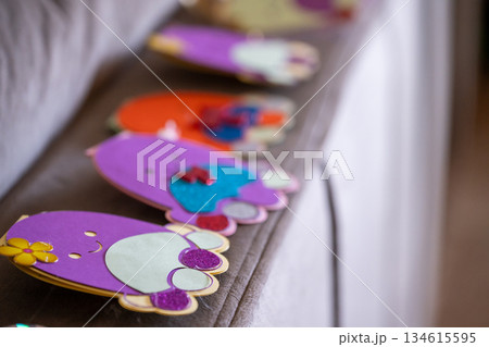 Colorful crafts on a table display during an art activity at a community center in the afternoon Colorful crafts on a table display during an art activity at a community center in the afternoon 134615595